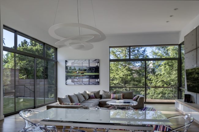 Nature becomes more in focus as one moves to the kitchen in this modern home by Marc McCollum.
