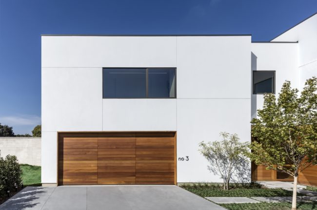 Stark modern front façade in dense North Dallas neighborhood.