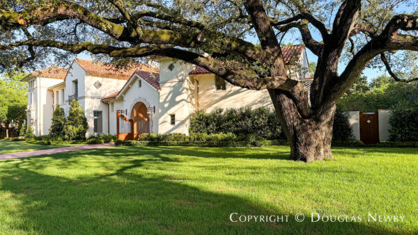 This rare nearly one-acre lot in Highland Park, Dallas, Texas, features a live oak tree.
