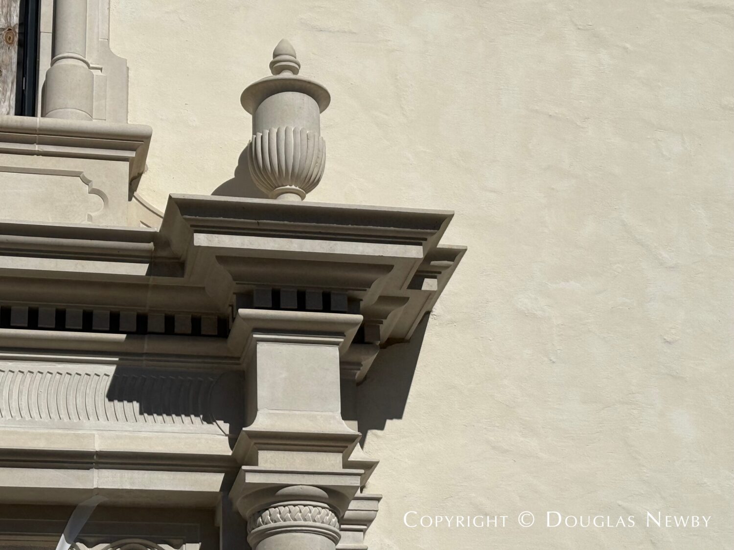 The carved stone at 4400 Belfort Place is a Mediterranean Revival style detail that accentuates the Spanish Revival style home in Highland Park, Texas.