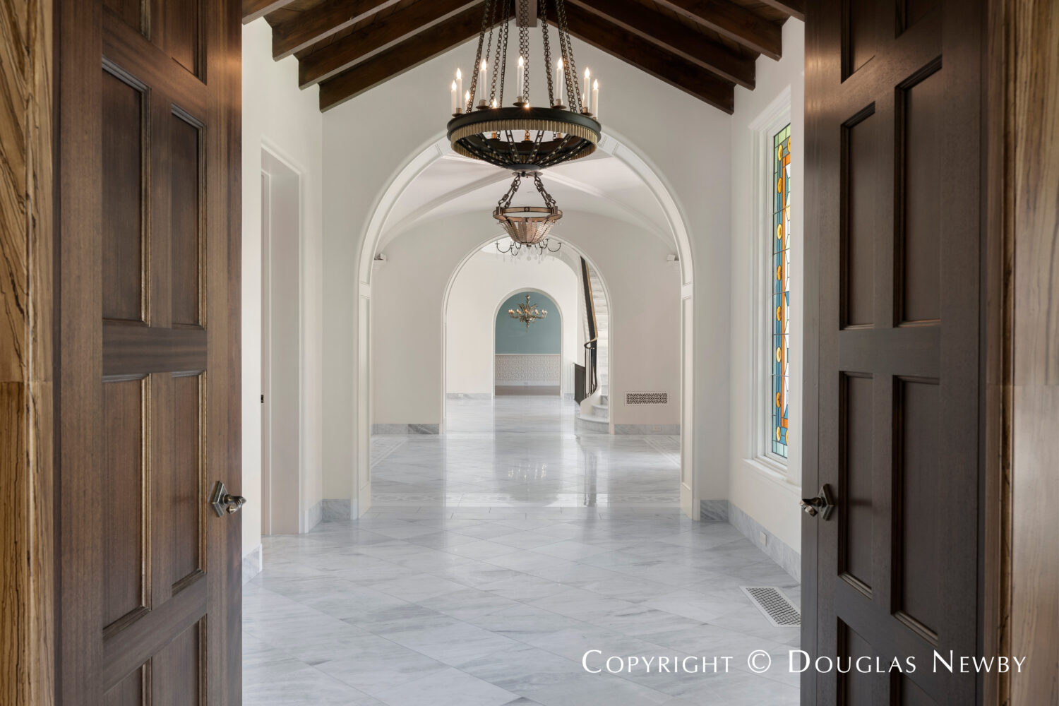 Grand hallway traverses the width of this Highland Park home at 4400 Belfort Place in Dallas, Texas.