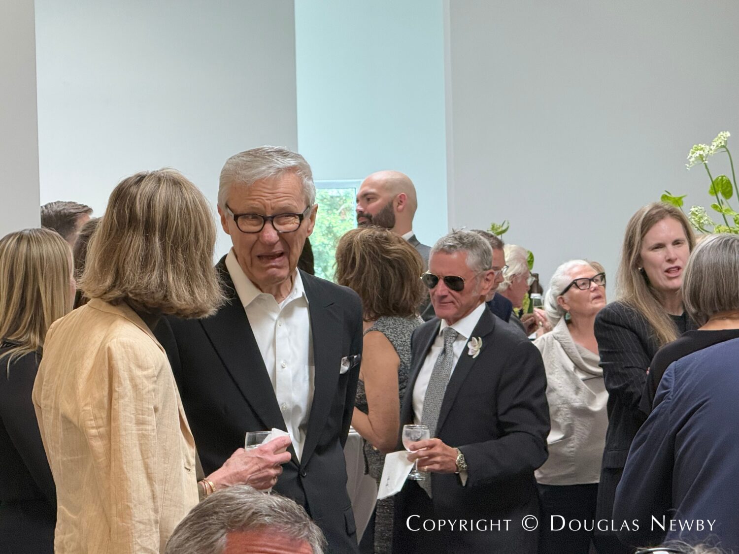 Allen Questrom is seen in conversation at the Celebration of Life for John Reoch.