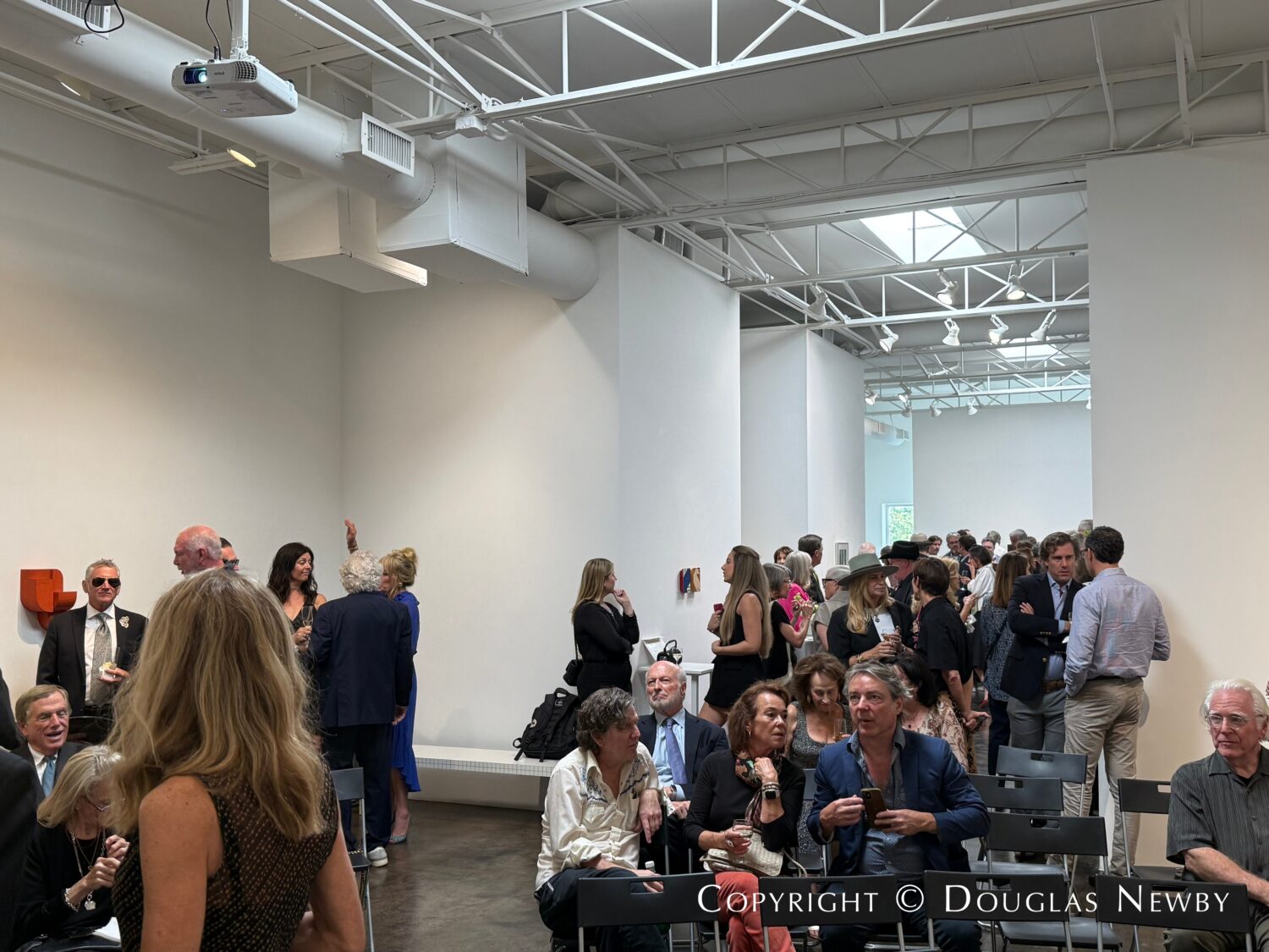 Friends and family gathering for the John Reoch Celebration of Life at the Conduit Gallery in Dallas.