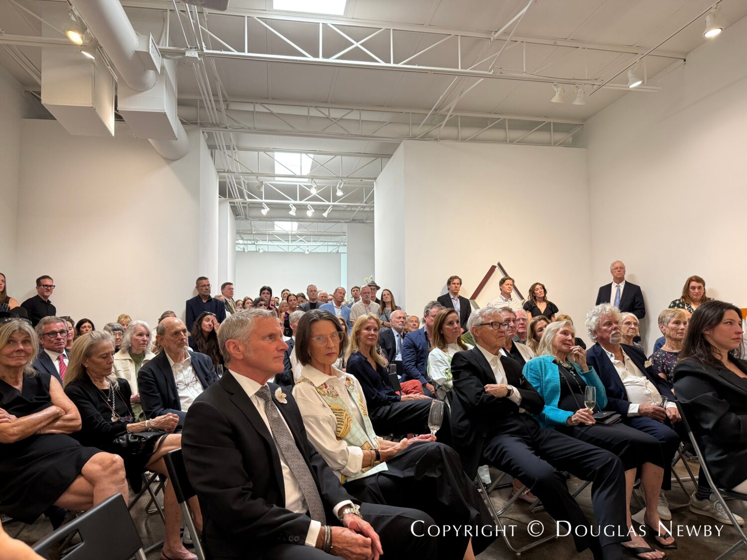 Guests at the Celebration of Life service for John Reoch held at the Conduit Gallery in the Turtle Creek area of Dallas.
